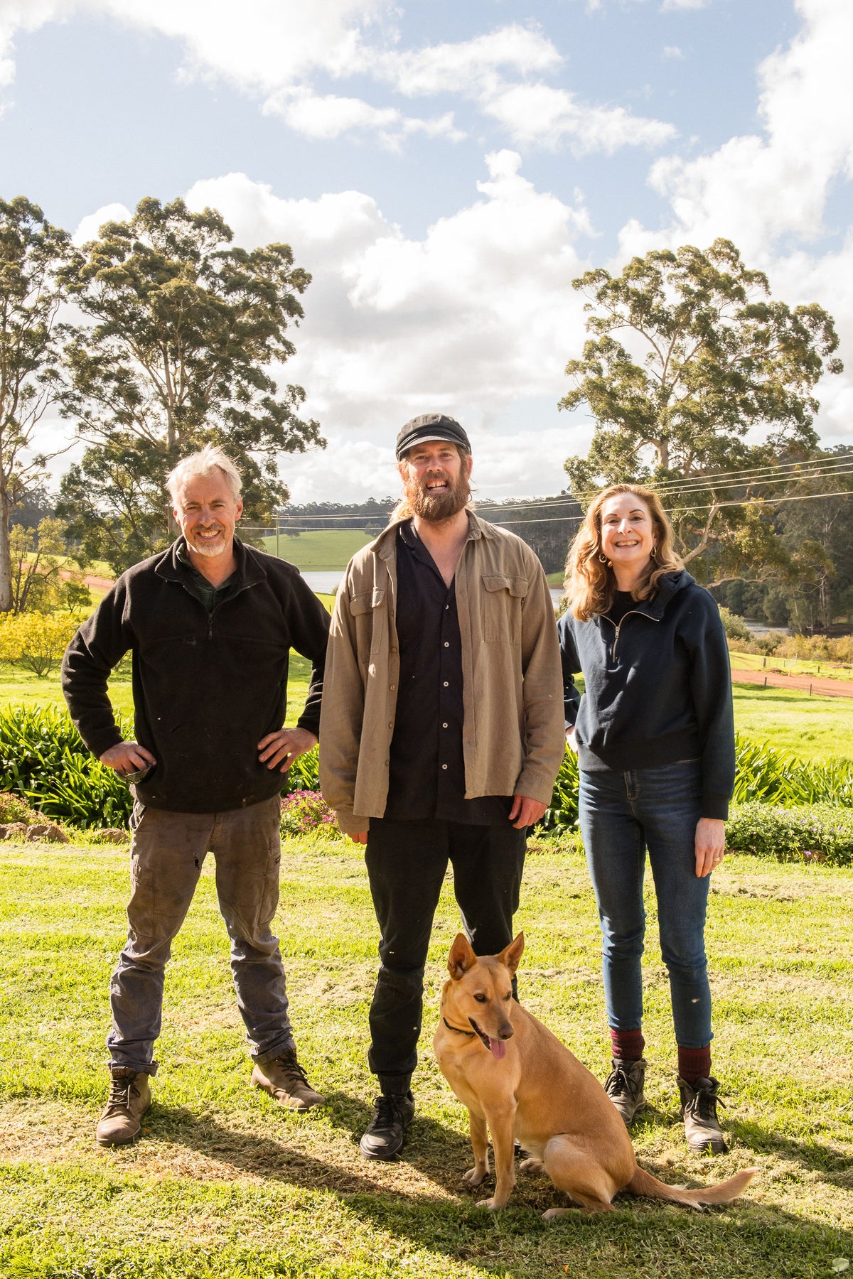 Chef Glen with the Lake Janis farmers and the farm dog on the farmhouse lawn