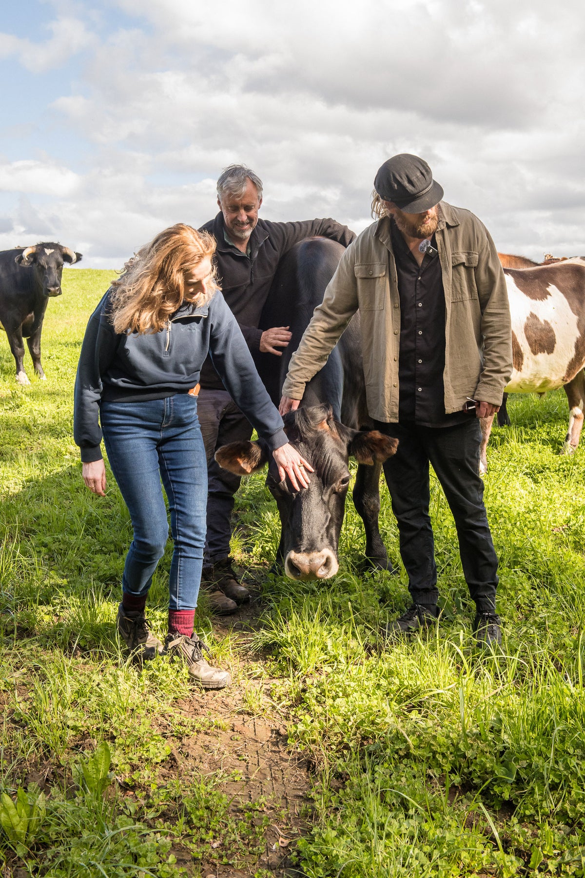 Chef Glen and the Lake Janis farmers with a Jersey cow in the paddock