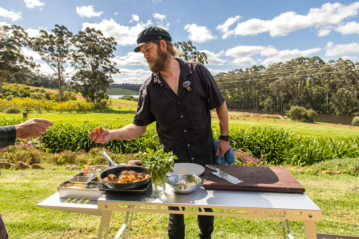 Glen plates up at the outdoor kitchen on the farm