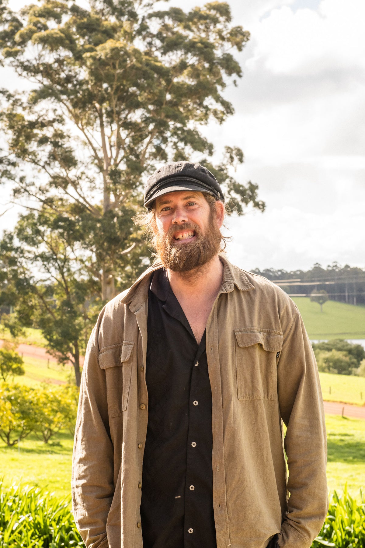 Chef Glen smiling in the farmhouse garden
