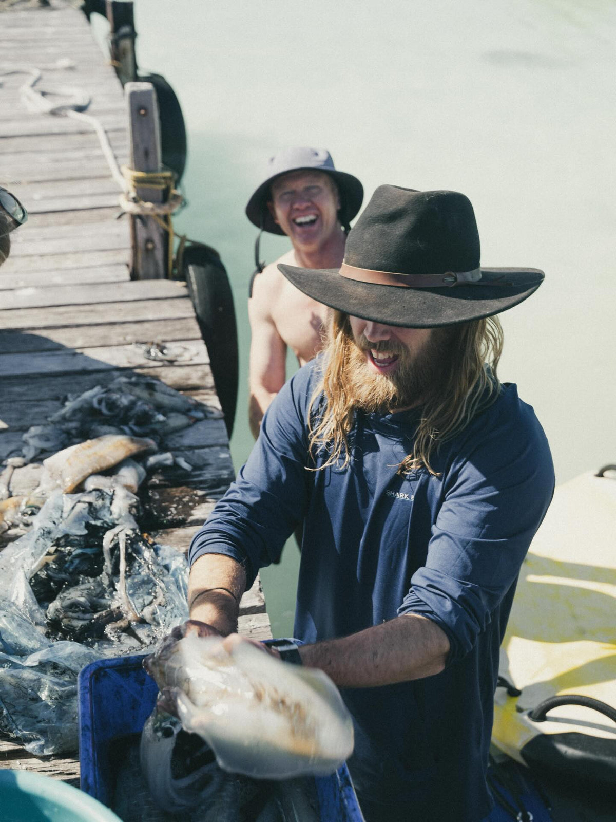 Chef Glen holding a fresh catch on the Shark Eyes island trip