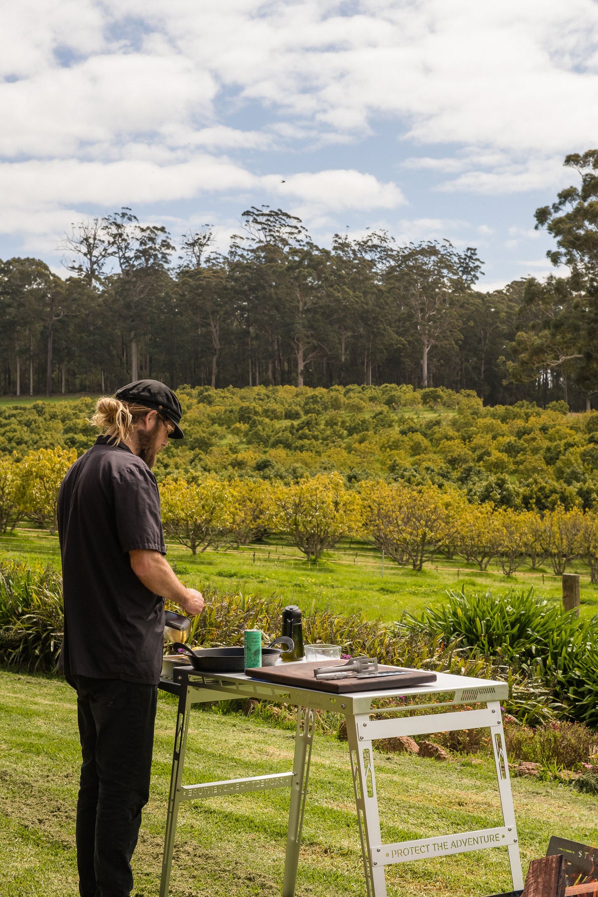 Chef Glen preparing ingredients beside the Stratus Outdoors fire pit